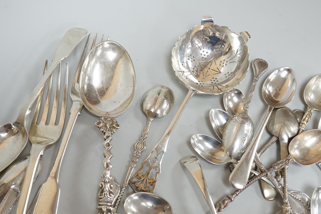 A small group of assorted mainly 20th century silver flatware, including teaspoons, replica spoons, dessert forks, sifter spoon, tea strainer, condiment spoons, Dutch white metal spoons, etc, various dates and makers, 17